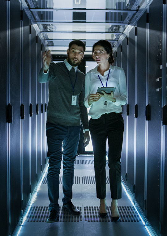 Two analysts in a datacenter